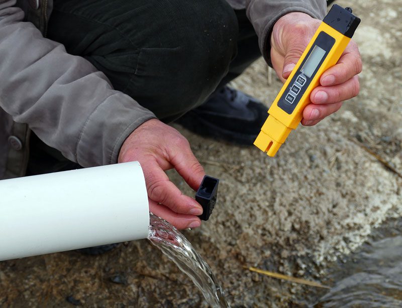 A men taking water samples